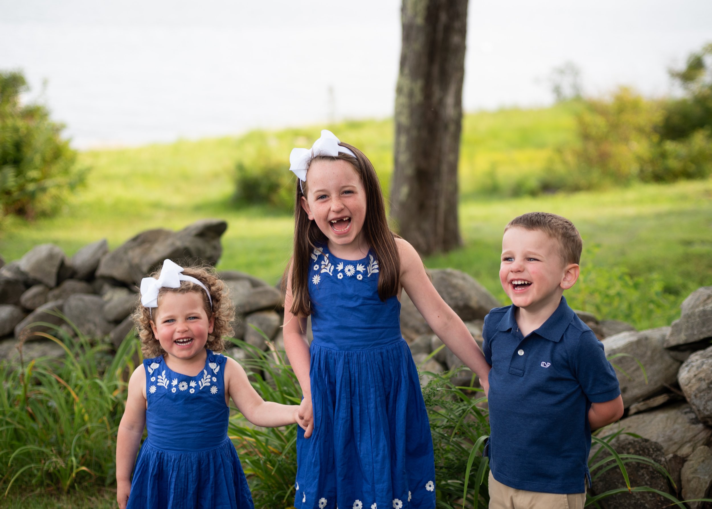 lindsay murphy photography | portland maine family photographer | siblings laughing on chebeague island.jpg