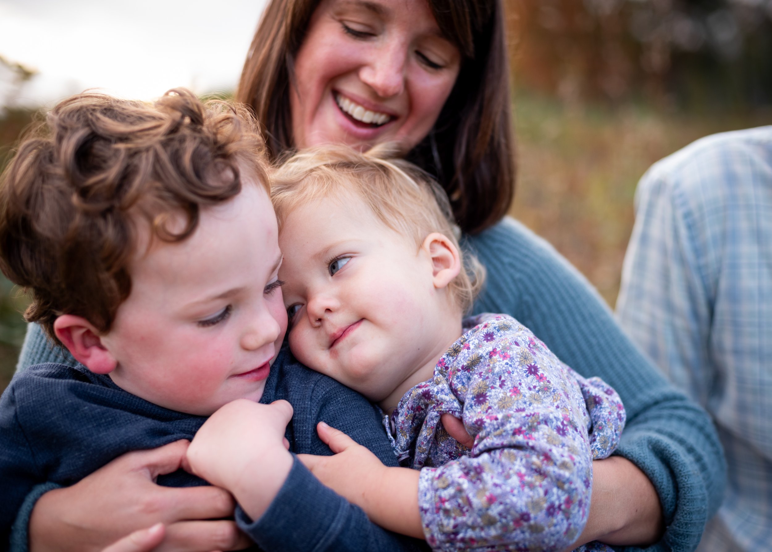 lindsay murphy photography | portland maine family photographer | siblings snuggling mom smiling photo.jpg