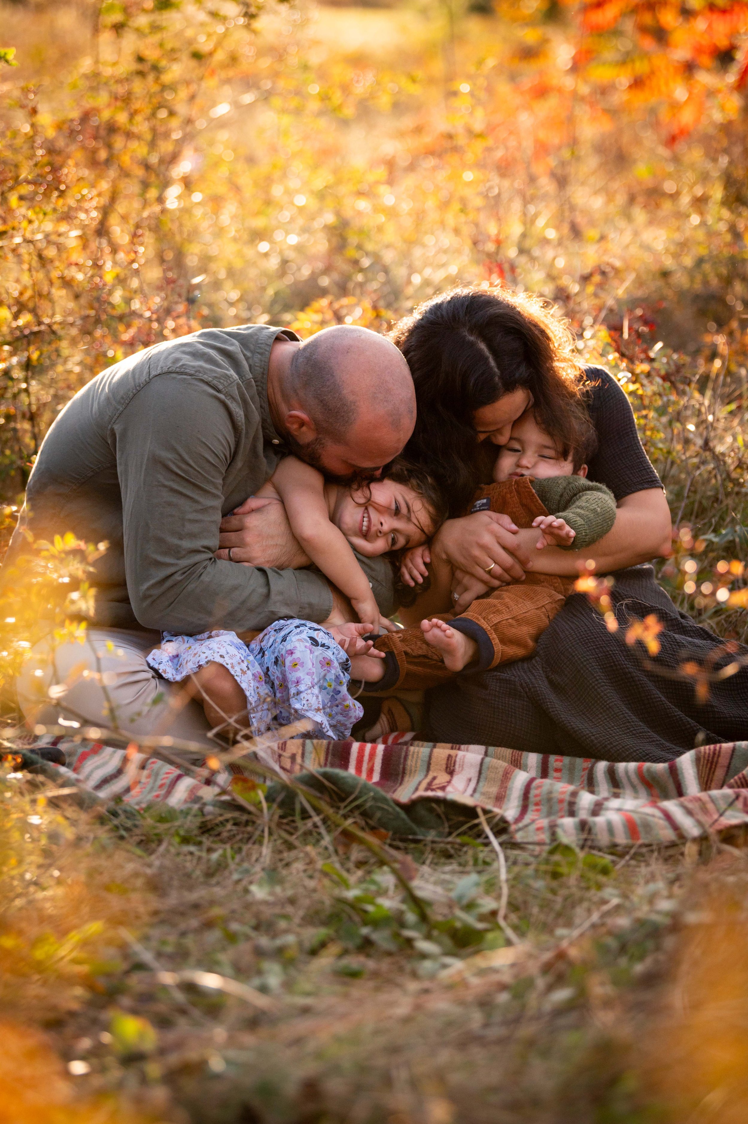 lindsay murphy photography | portland maine family photographer | warm wildlower field family cuddling.jpg