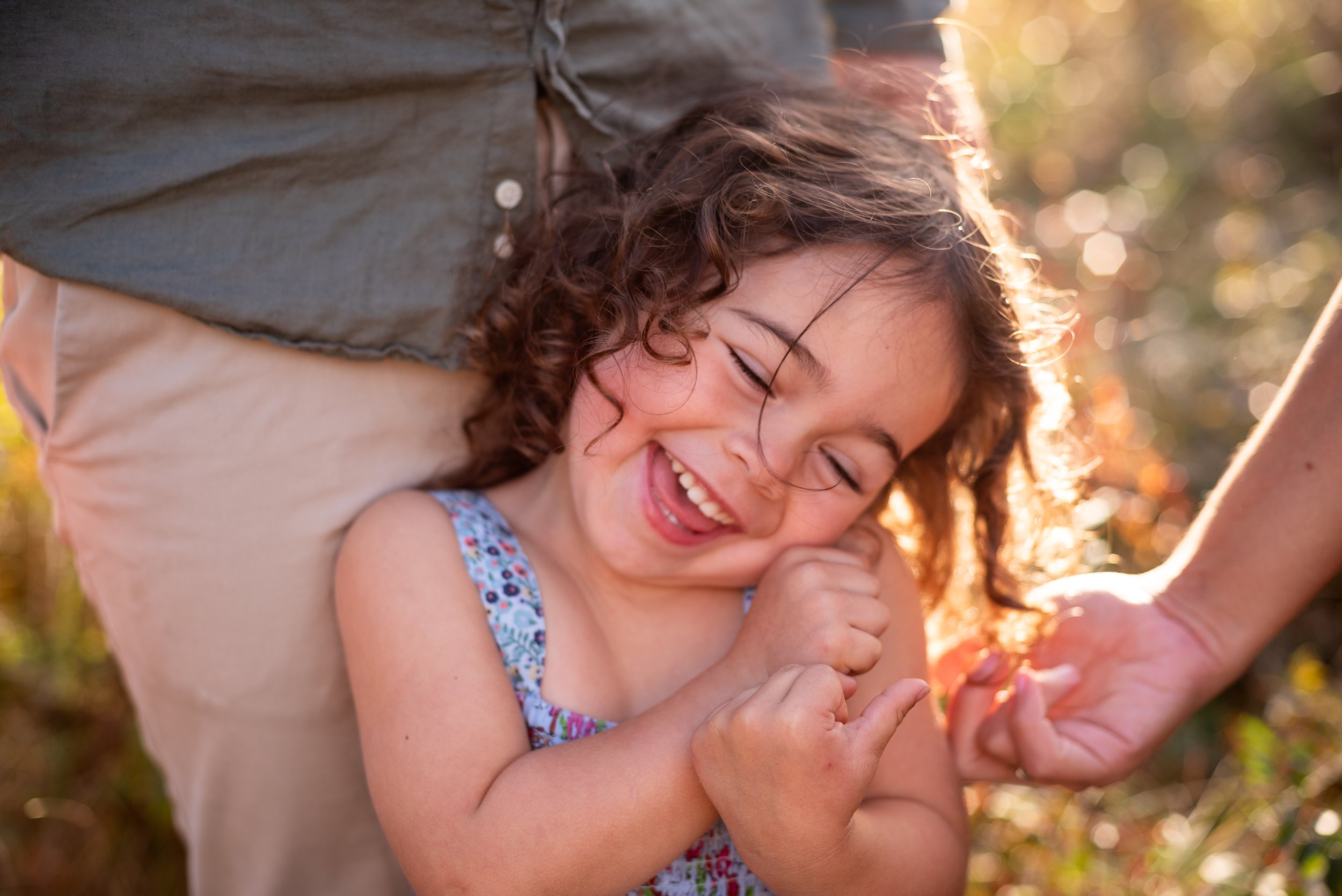 lindsay murphy photography | portland maine family photographer | little girl laughing in sun.jpg