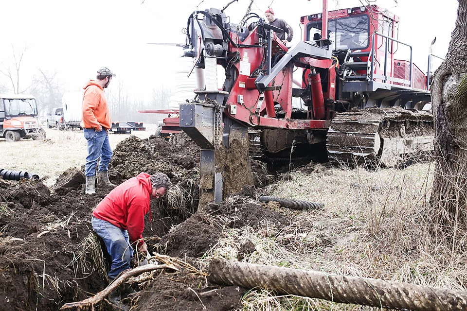  Farm tile being installed on a farm owned by Ed Thompson, Sidney.&nbsp; 