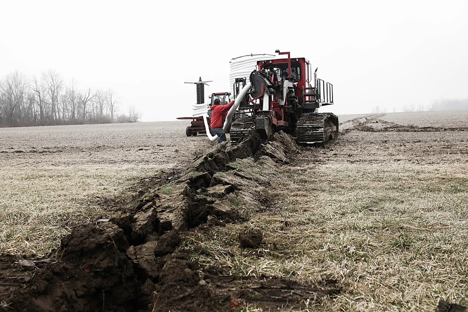  Farm tile being installed on a farm owned by Ed Thompson, Sidney.&nbsp; 