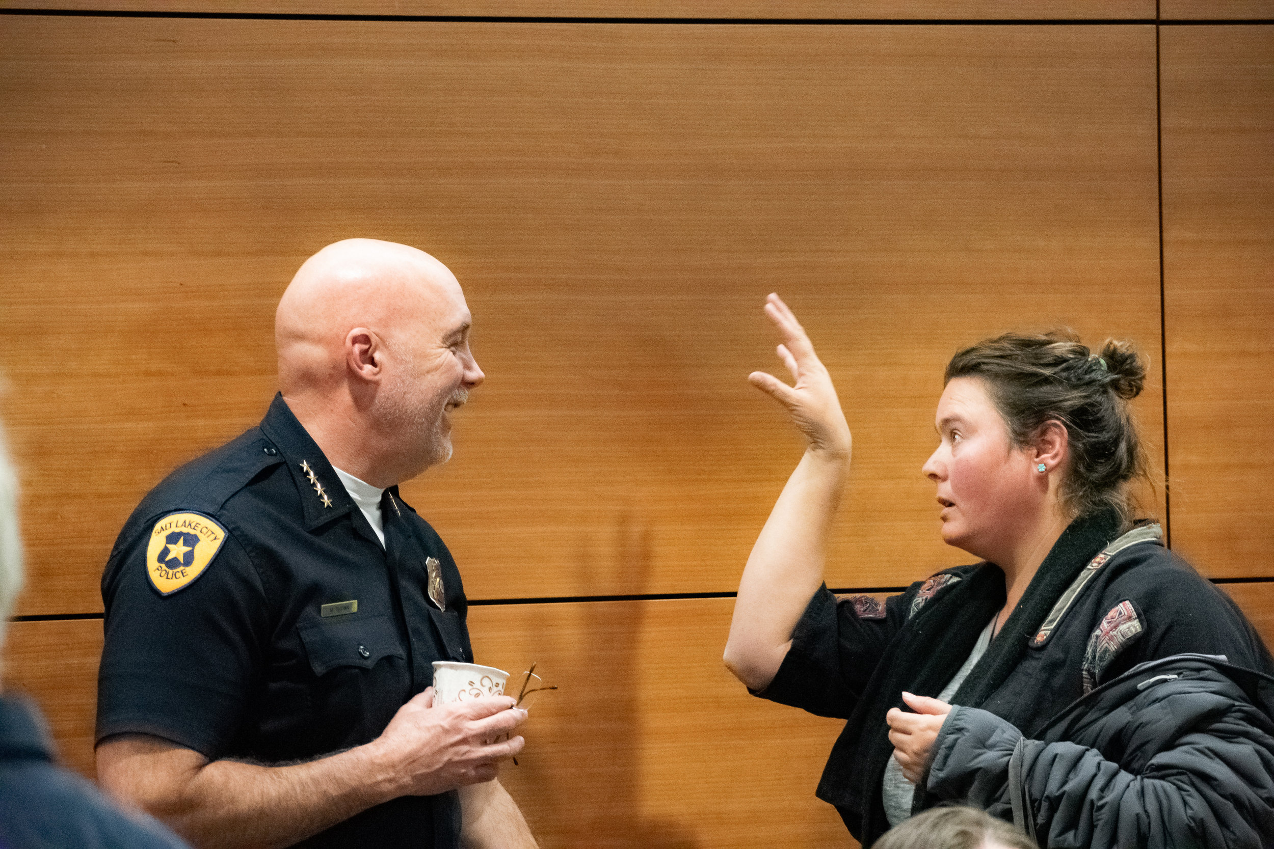  Chief Brown talking with Community Advocates Group attendee   