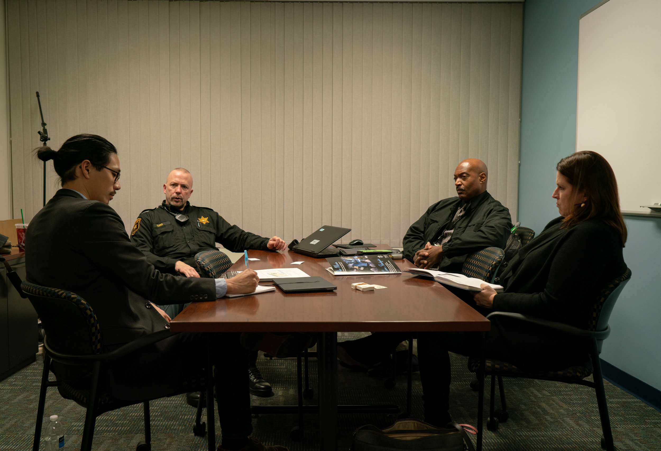  Policing Project Senior Program Manager Brian Chen and National Police Foundation Director of Programs Jennifer Zeunik meet with Lieutenant Keith Flores and Sergeant Eugene Rush. 