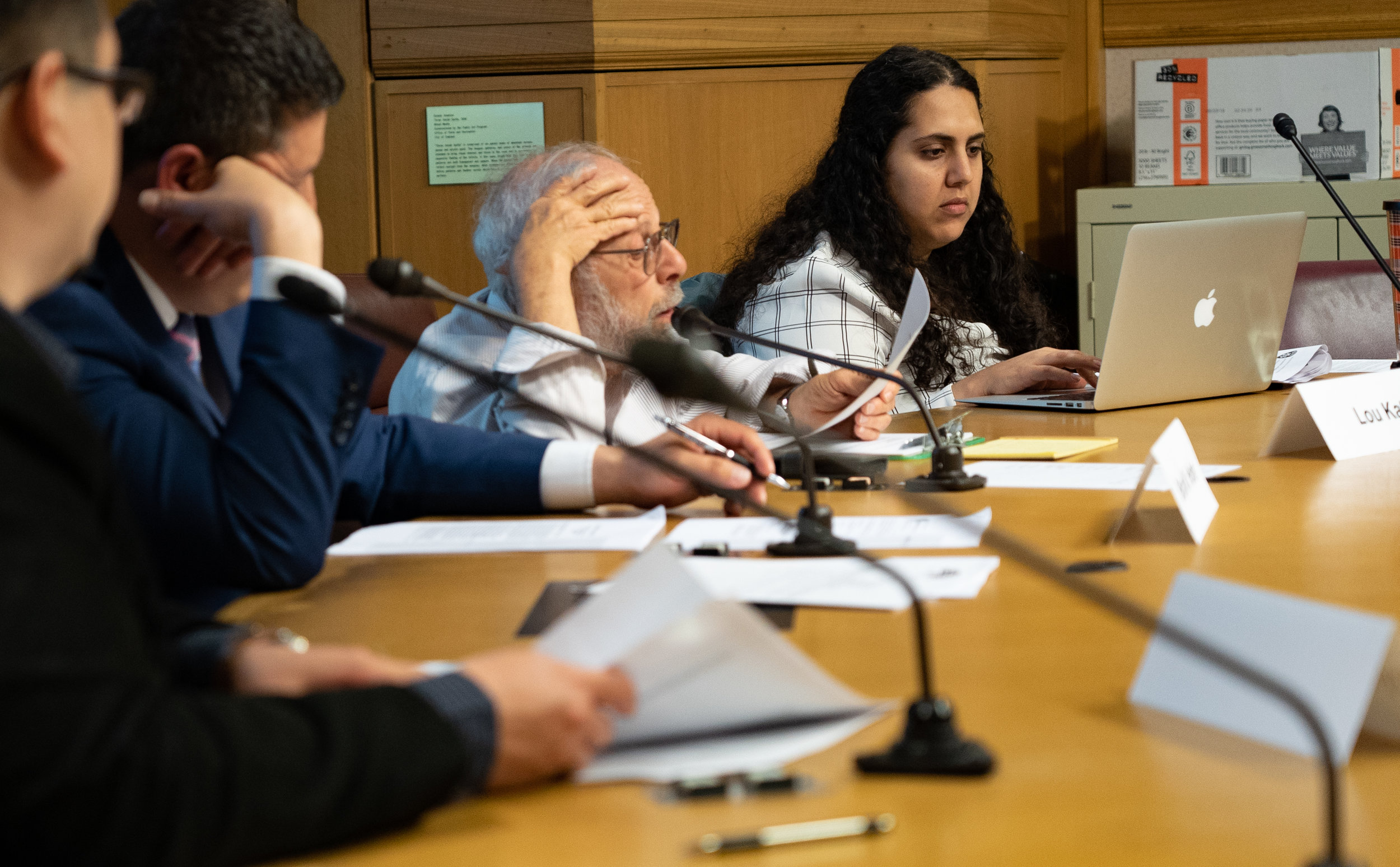  OPAC members Brian Hofer, Lou Katz, and Reem Suleiman review notes during the Commission's April 2019 meeting.  