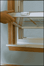 Gently rock sash several times to make sure pivot bars are seated securely into shoes, then tilt sash to upright and close.