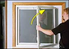 With top pivot bar in top shoe, bring sash completely vertical while closing it flush to window frame.