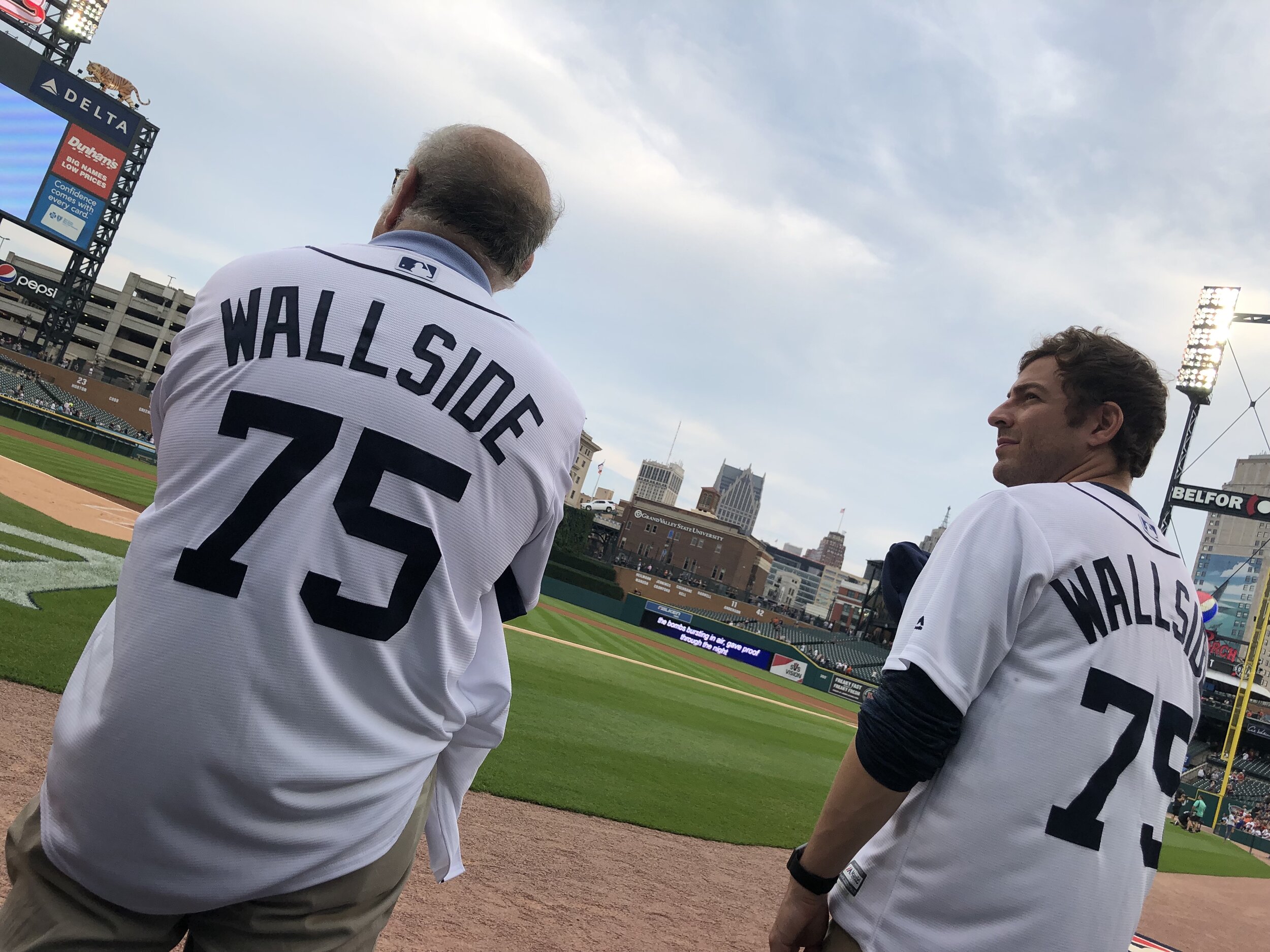 Stanford and Adam Blanck stand on the edge of the field at Comerica Park, just before the start of Tuesday’s Detroit Tigers game.