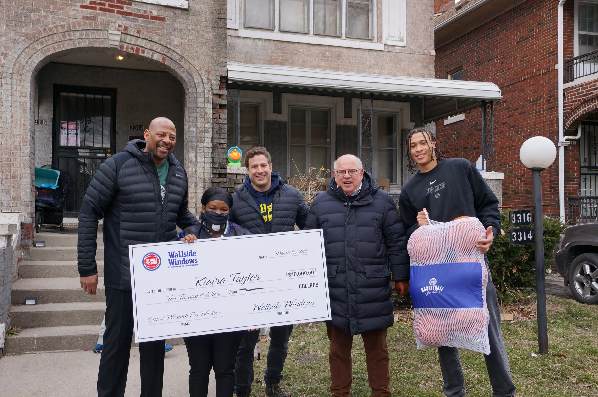 Wallside Windows and Detroit Pistons surprise Detroit family with new windows through the Gift of Warmth