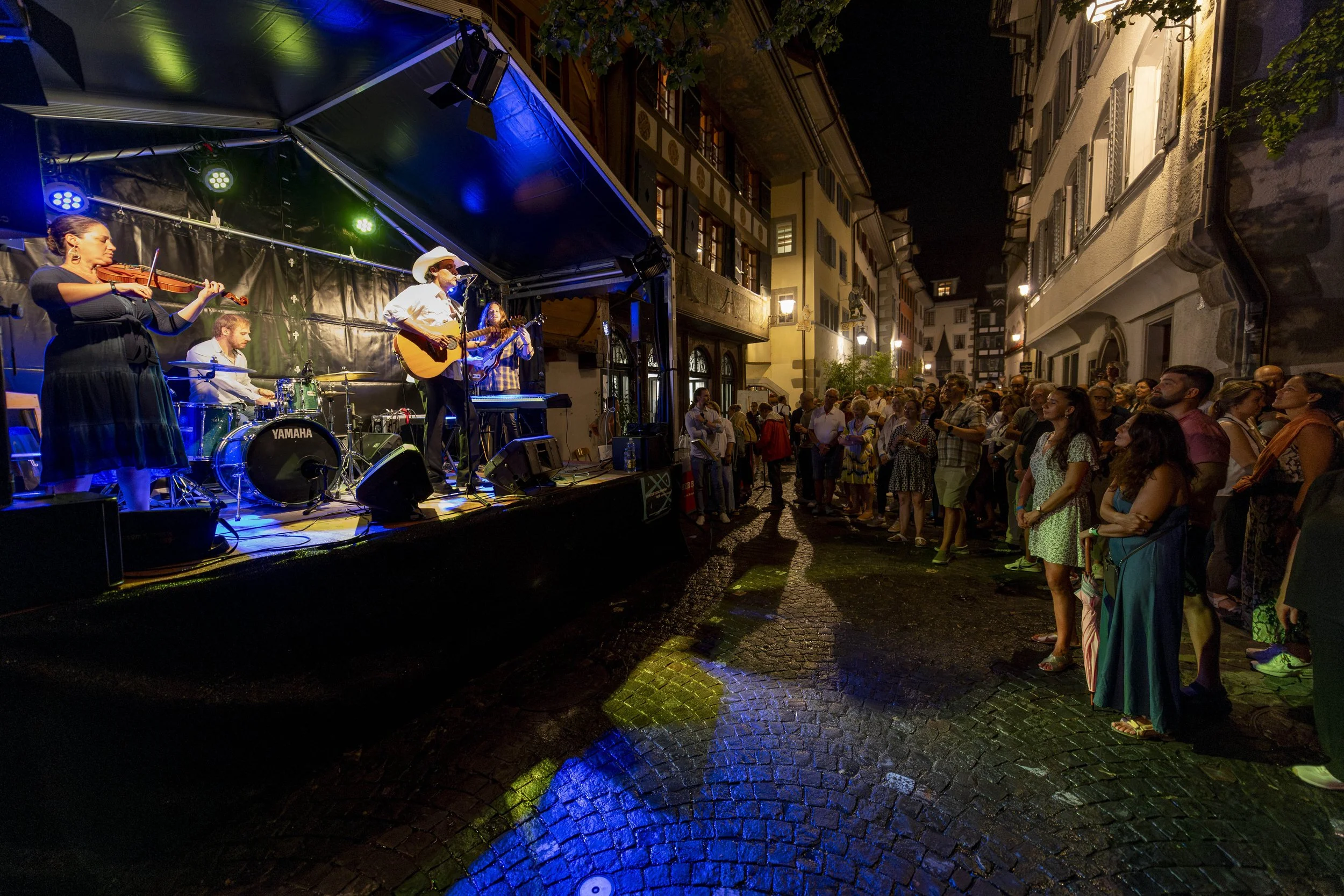 Anthony Garcia and Los Diablos Tejanos performing for a crowd in Zug, Switzerland