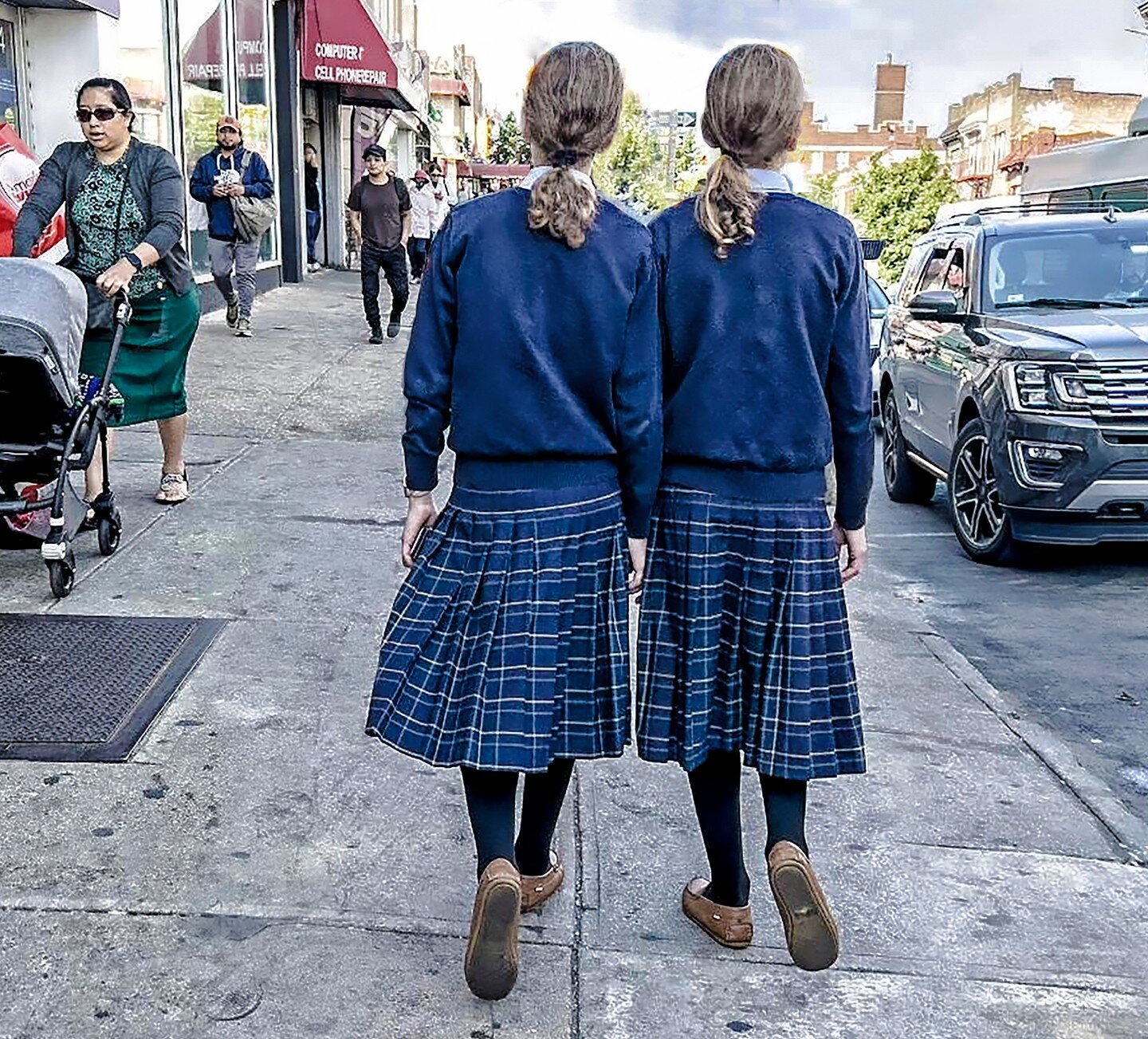 Bensonhurst twins, holding hands. #redrum 
.
.
.
.
#afterschoolspecial #twins #dianaarbus #southbrooklyn #18thave #kilts #womenstreetphotographers #everydayusa #everydayeverywhere #thepictorialist #womenstreetphotographers #life_is_street #streetphot