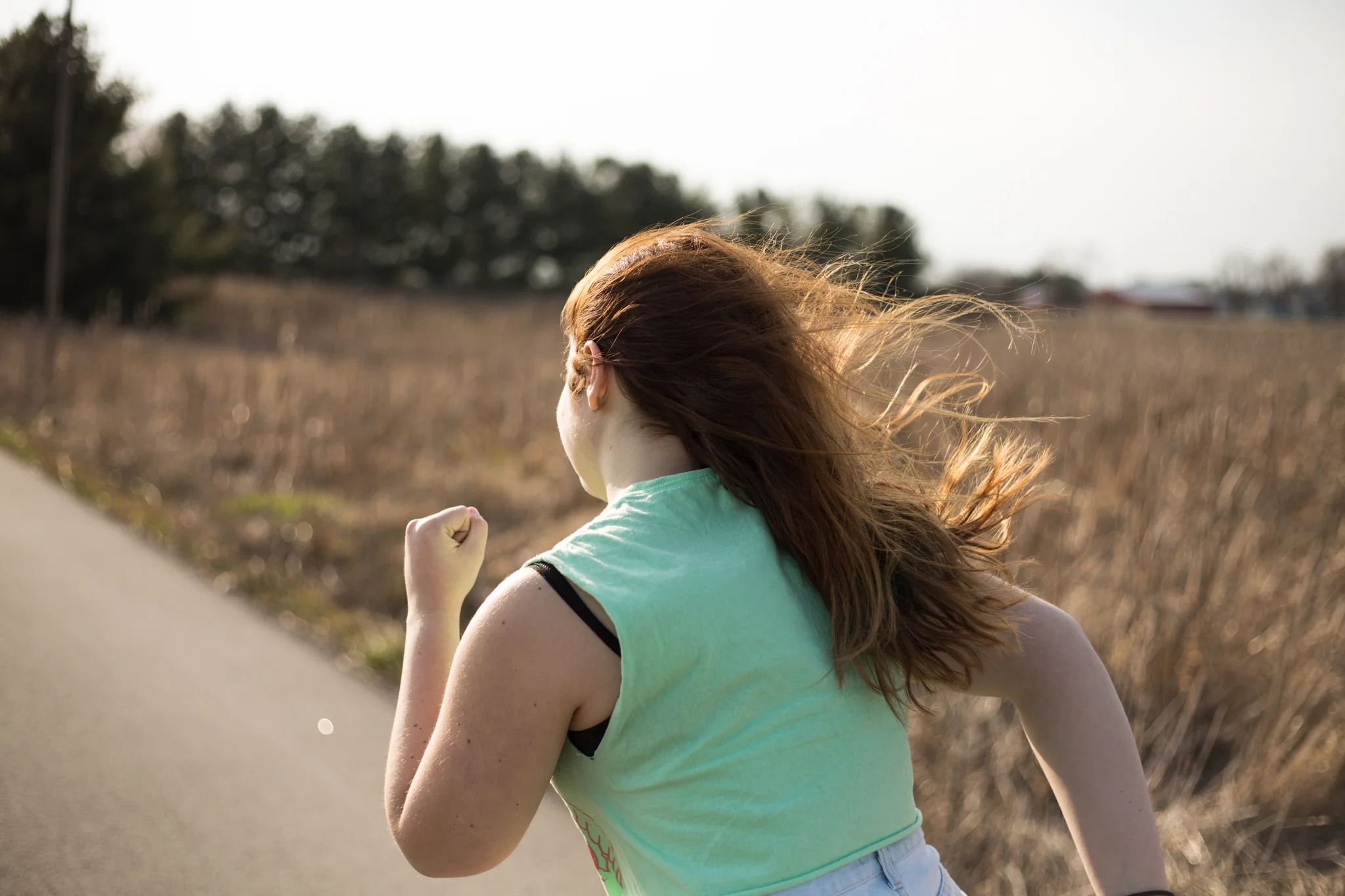 My friends Abby, Sam and I went for a drive one of the days it was sunny and beautiful. I had to make one of them run down an Indiana backroad as I snapped pictures of their tangled sunlit hair.