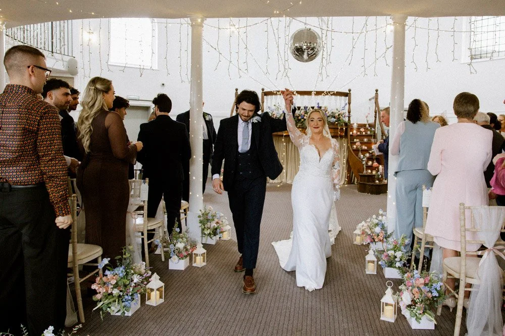 wedding-couple-walk-out-together.jpg