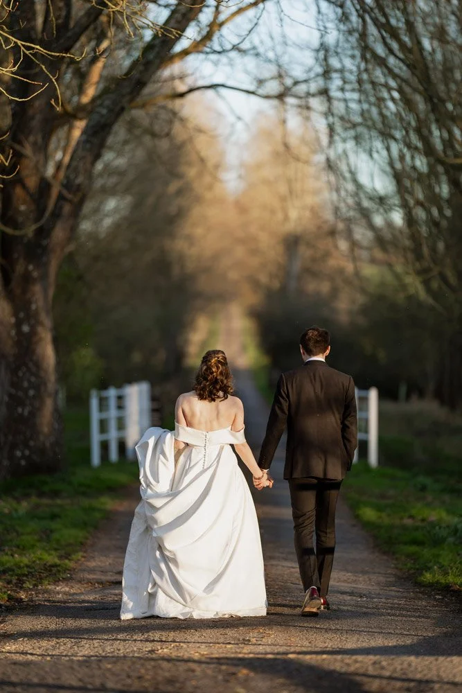 wedding-couple-walking-away-oxfordshire.jpg