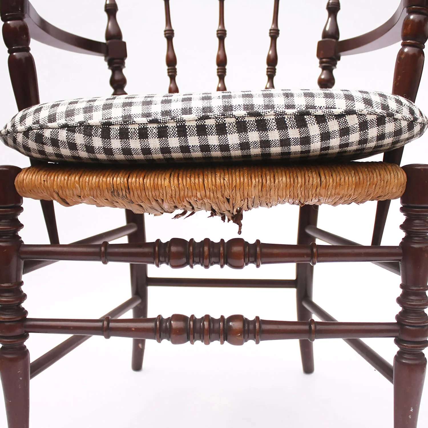 vintage spindle armchair with gingham cushion