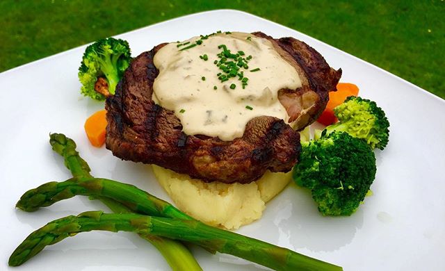 Tender Ribeye on mash with creamy mushroom sauce and seasonal veg.