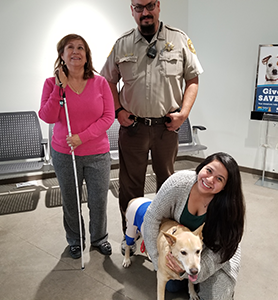 Officer Robledo with Birdy and her family.