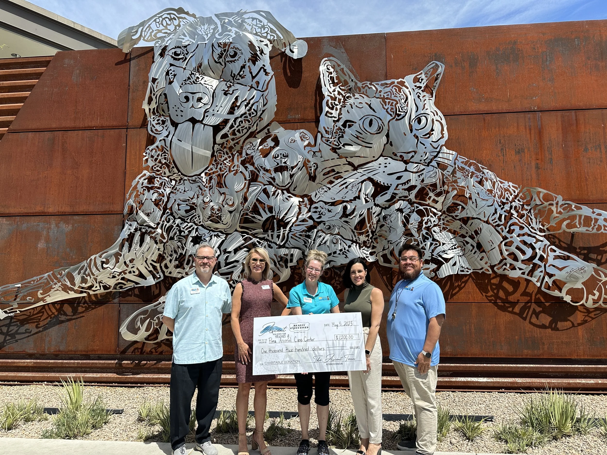 The Ascent Real Estate Team Donates $1200 to Friends of Pima Animal Care Center for PACC Pets
