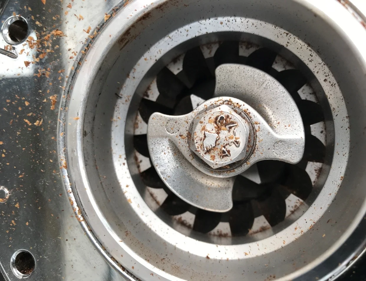 Figure 4a.    A pre breaker on a mazzer robur grinder that serves to regulate the feed of the beans into the burrs. Controlled weight, or feed rate into burrs is paramount for even grinding.