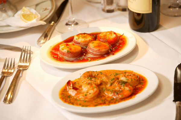 Pancetta wrapped scallops and BBQ Shrimp appetizers.