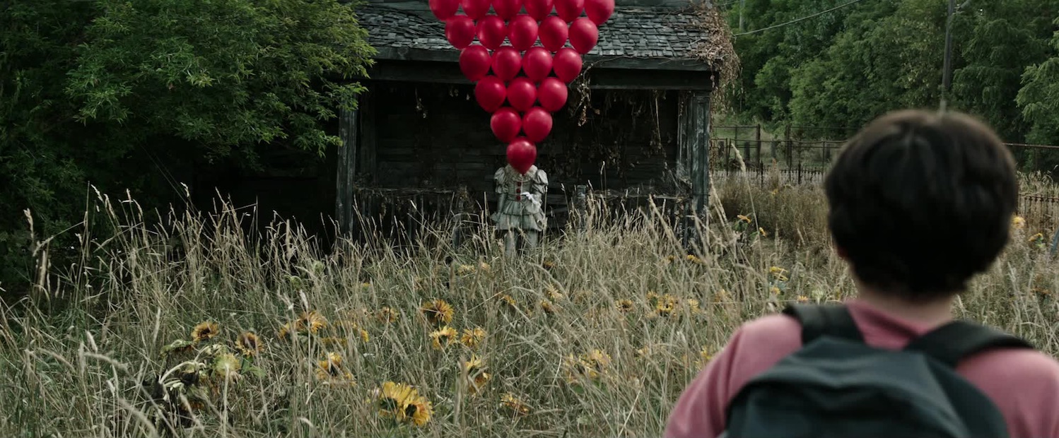 Bill Skarsgård and Jack Dylan Grazer in It