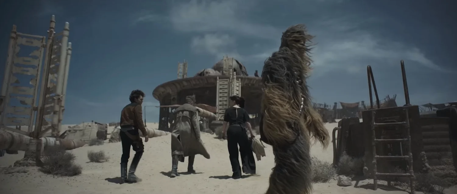 Left to right: Alden Ehrenreich, an unidentified actor, Emilia Clarke, and Joonas Suotamo in Solo: A Star Wars Story