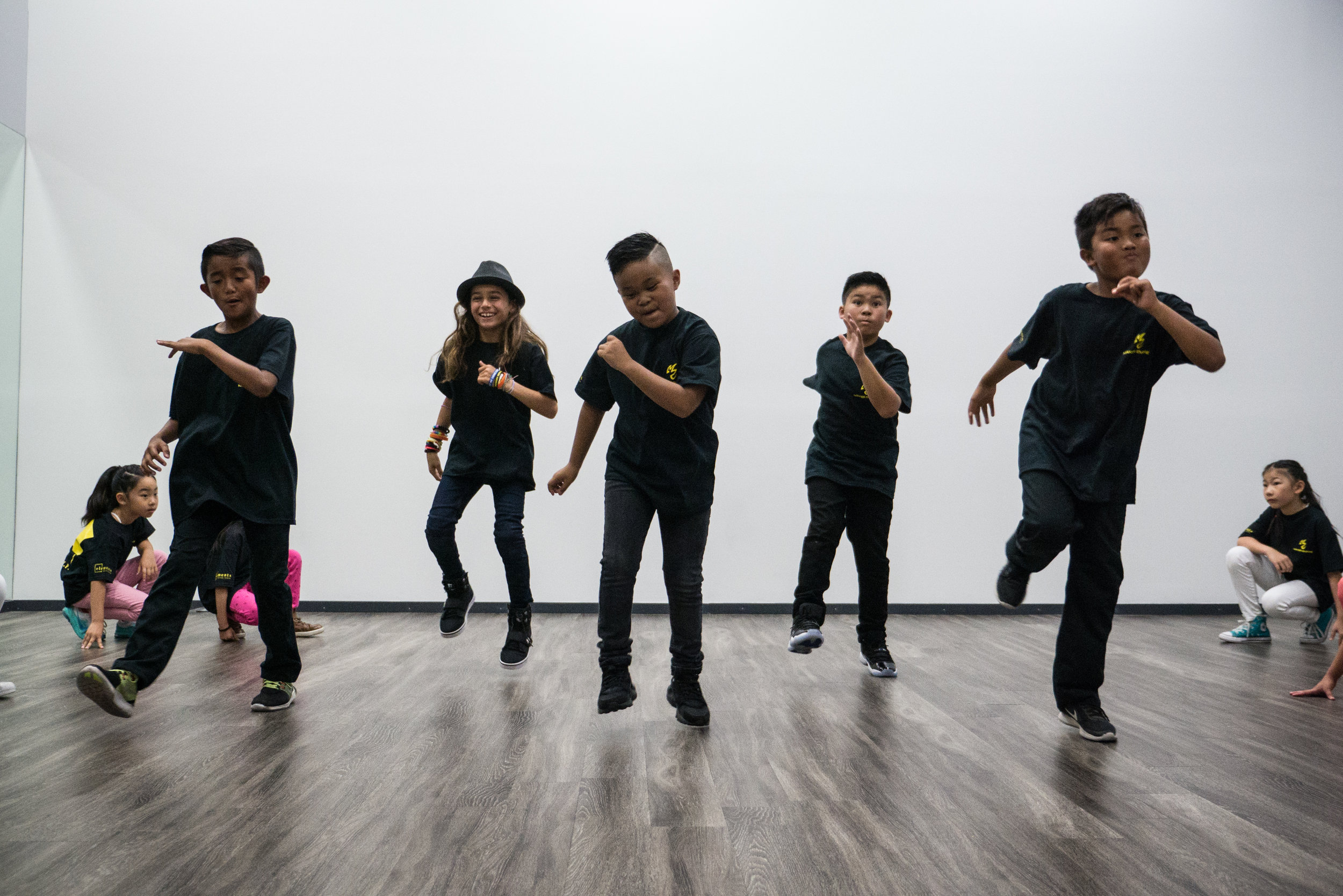 Students in a dance class mid-dance
