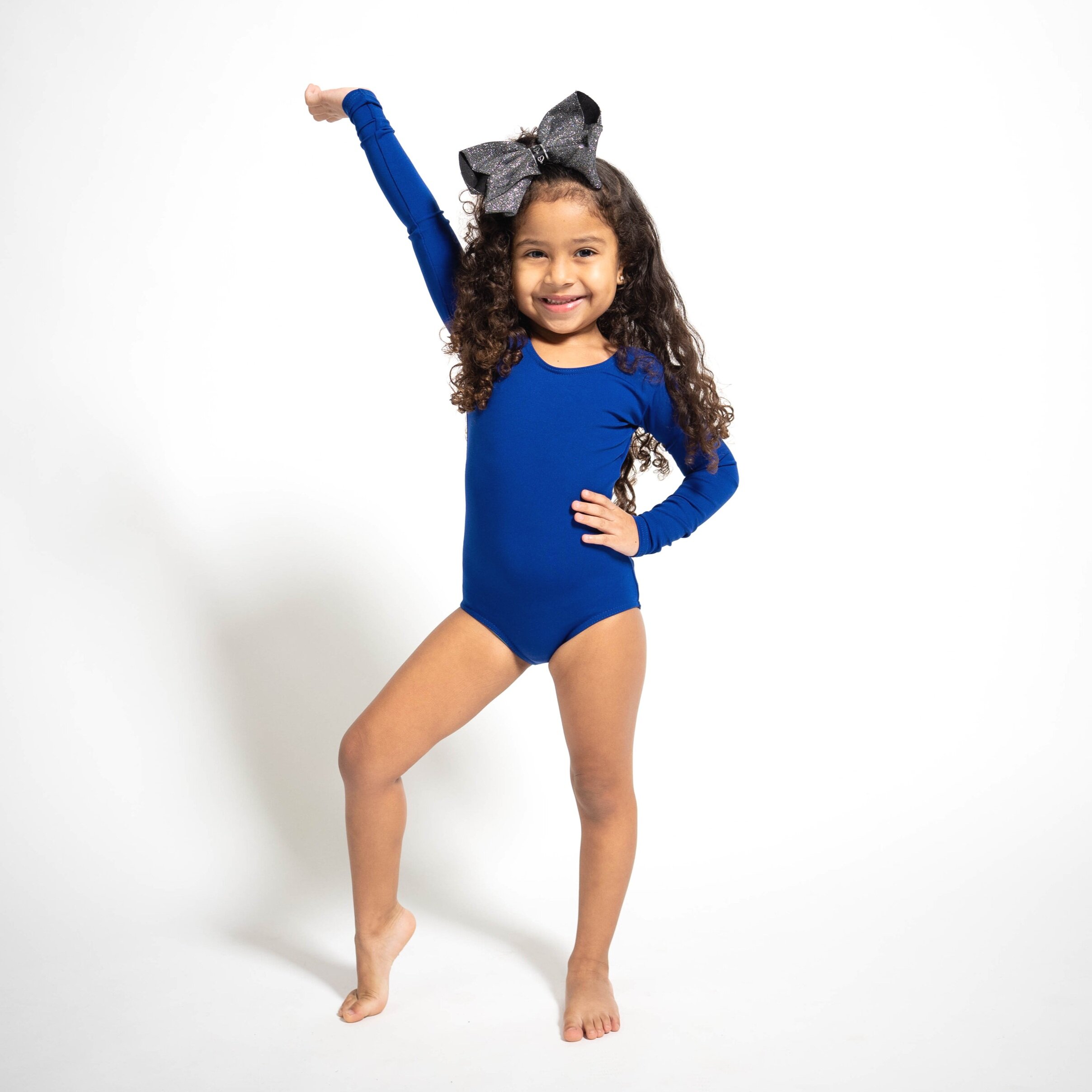 Photo of little girl in a dance pose.