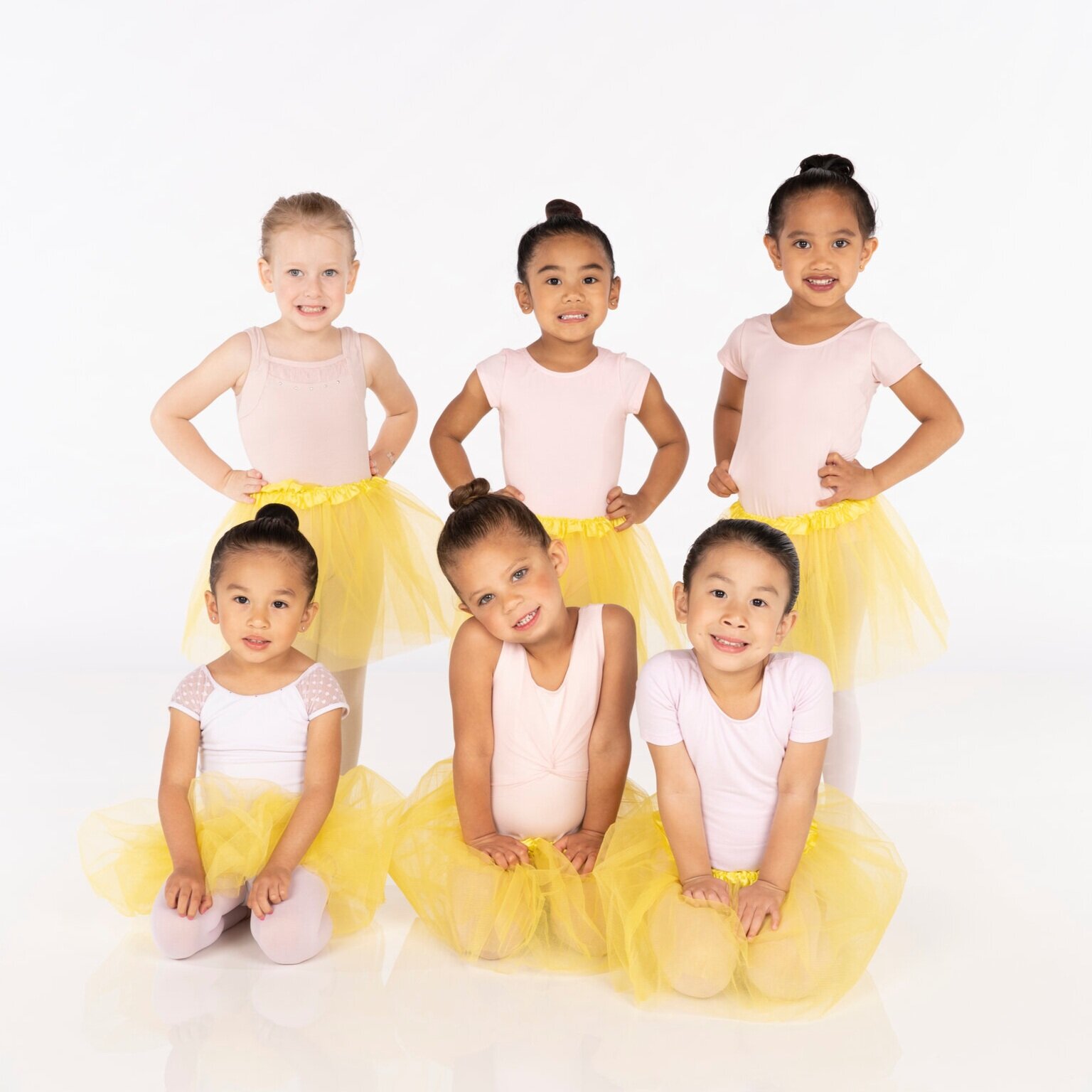Girls in pink leotards and yellow tutus. (Copy) (Copy) (Copy) (Copy) (Copy) (Copy)