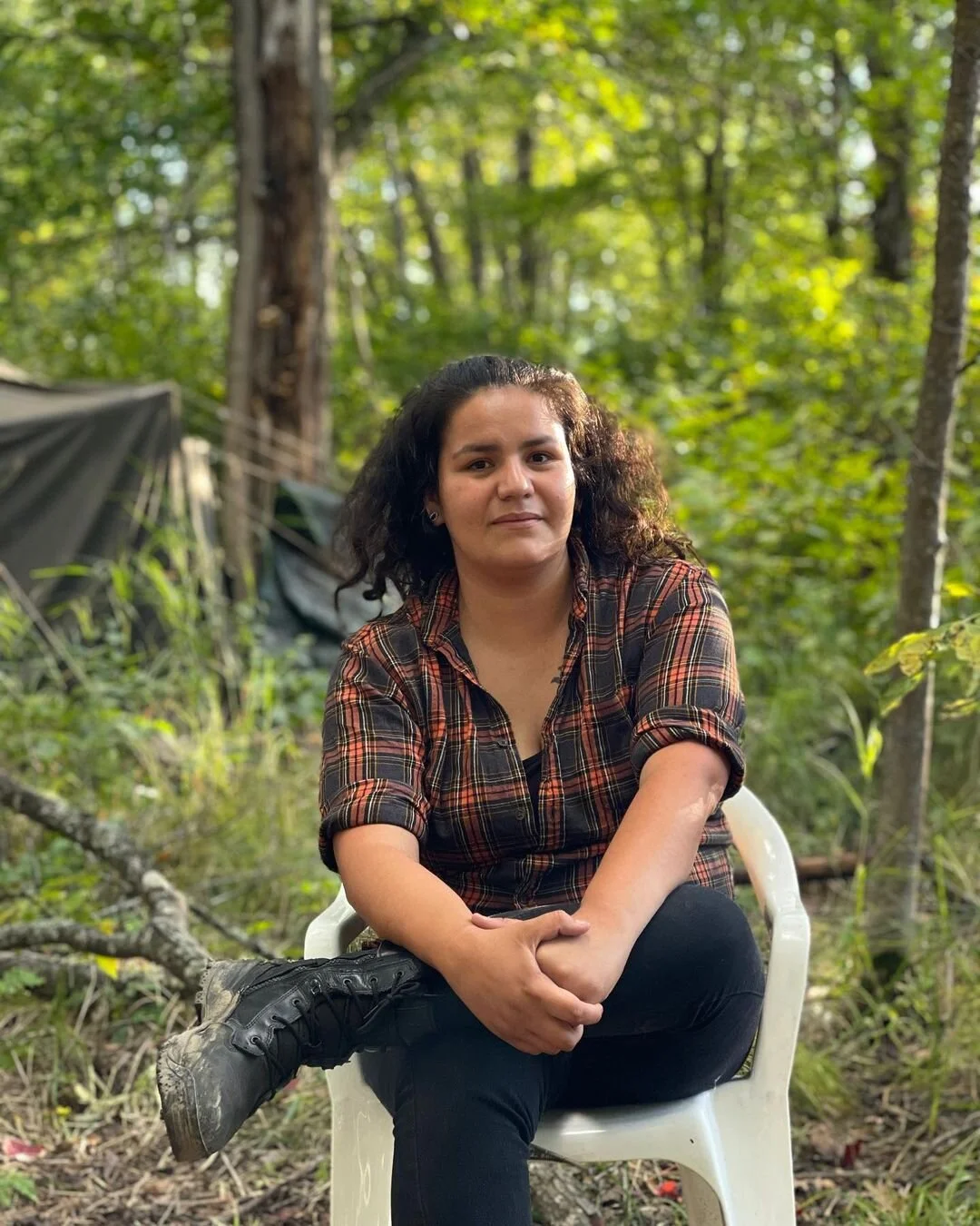 Taysha Martineau, Fond Du Lac Band of Lake Superior Chippewa, AnishinaabeTaysha Martineau is a Water Protector and a Missing &amp; Murdered Indigenous Women Activist from the Fond Du Lac Band of Lake Superior Chippewa, Anishinaabe. A two-spirit Indigenous anarchist, Taysha is the founder of Camp Migizi and co-founder of the Gitchigumi Scouts in so-called Northern Minnesota. A mother of four, she made a promise to her young daughter that she would do everything in her power to stop the Line 3 tar sands pipeline. Faced with a police line, Taysha is known to drop rose petals at their feet, offering the names of missing and murdered Indigenous women, two spirits, and girls, asking the officers to help to find and protect them, rather than protecting the Enbridge pipeline. (Photo by Keri Pickett)