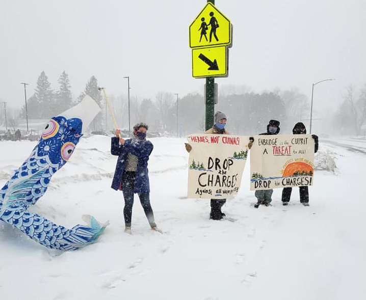  Water protectors outside Aitken County Courthouse braved the snow and cold to support those with hearings inside. Photo: Honor The Earth    