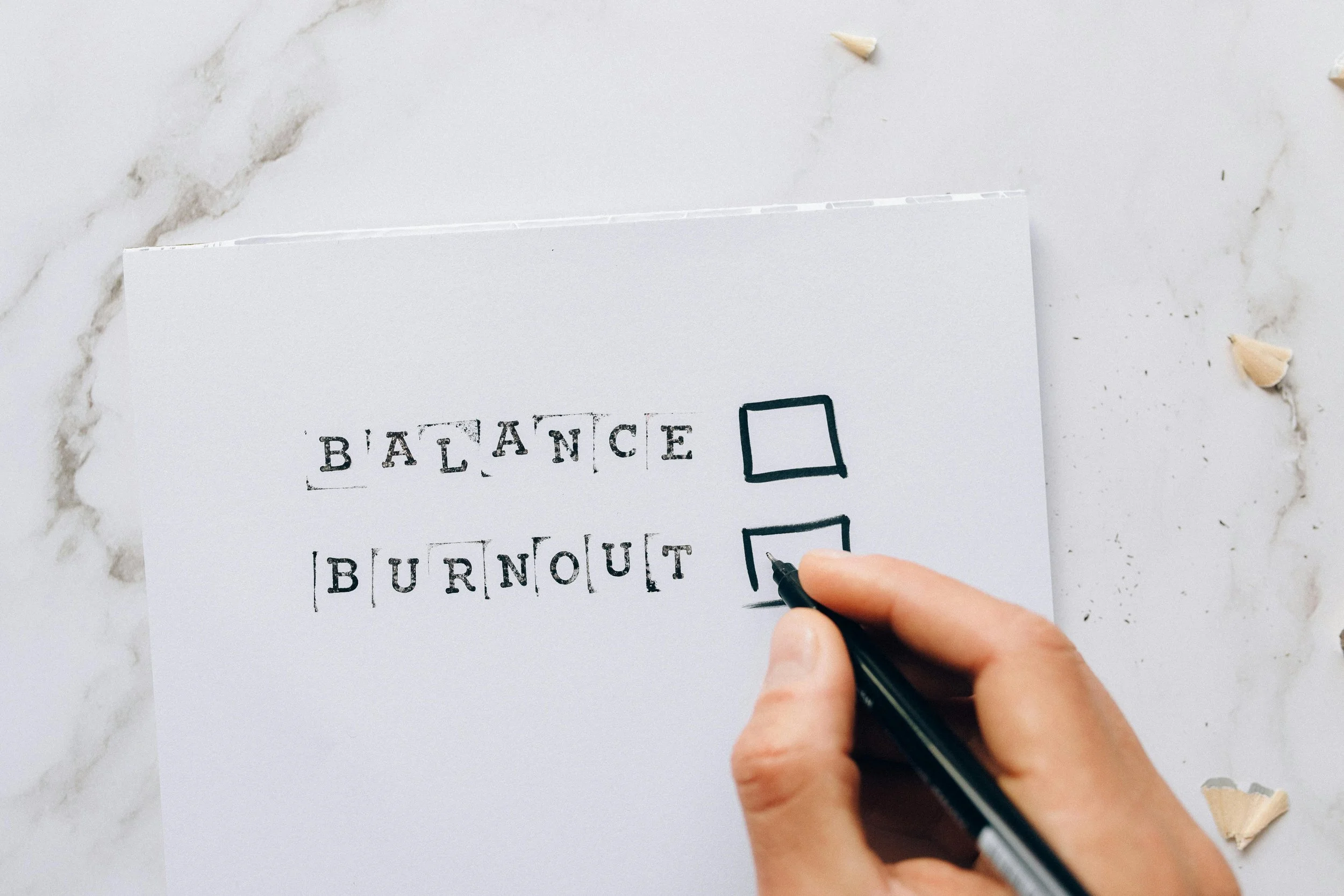 A person choosing between balance and burnout
