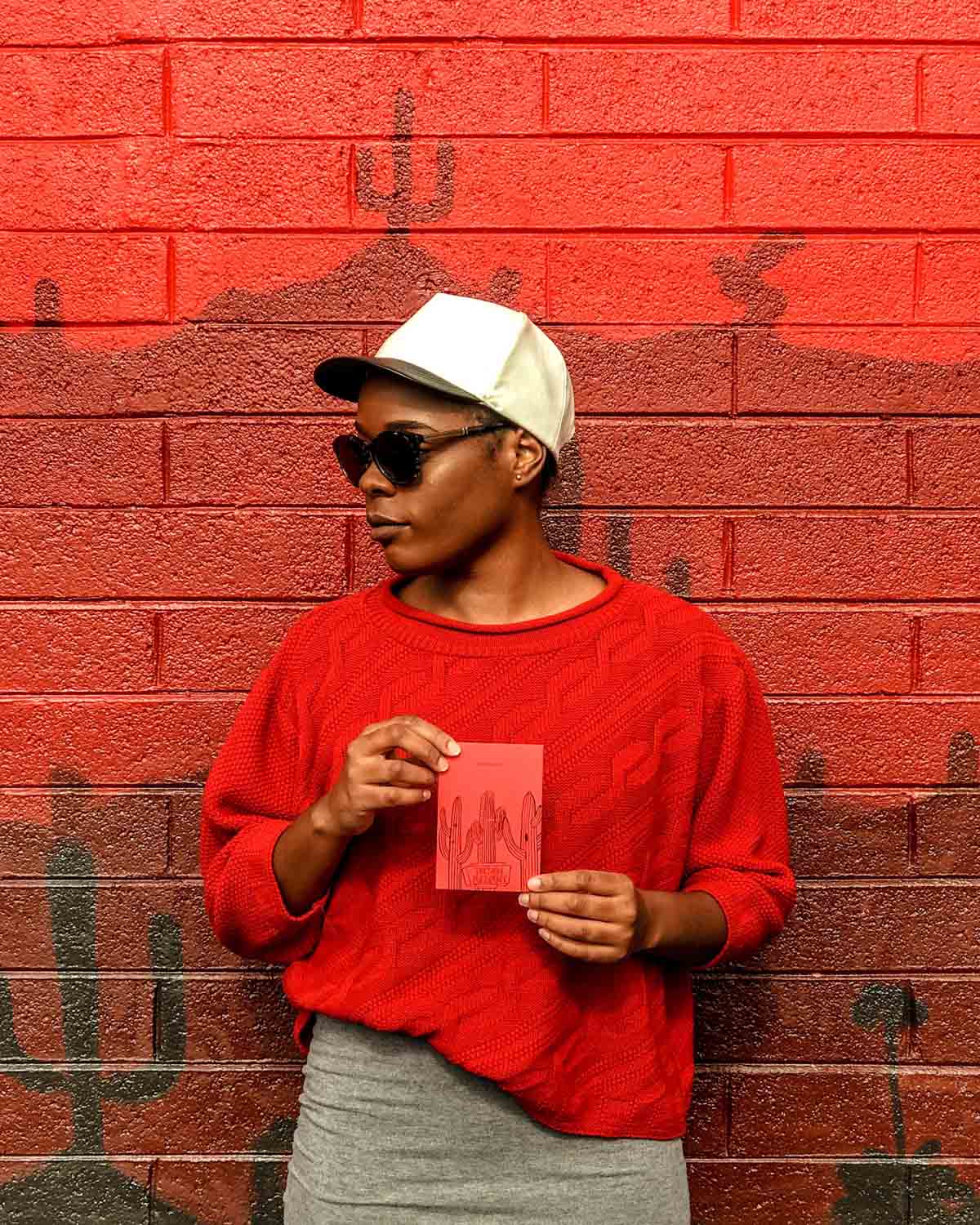 Michelle Johnson and I found a seemingly fitting "Tucson-Passport-red" wall after picking up the books in Phoenix prior to driving them to Tucson.
