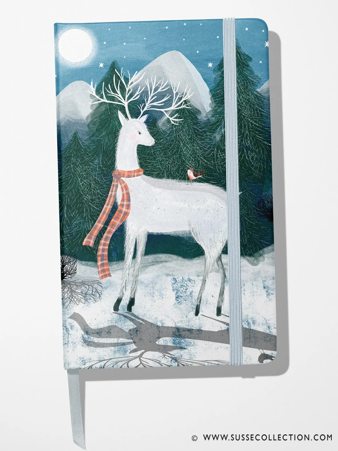 A photograph of an illustration of winter scene of a Scottish white stag and Robbin  on a note book