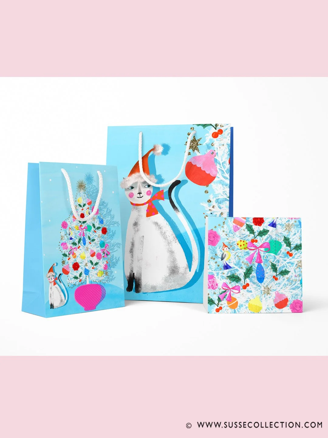 A photograph of a colourful illustration of a cat and mid century Christmas Tree. on gift bags