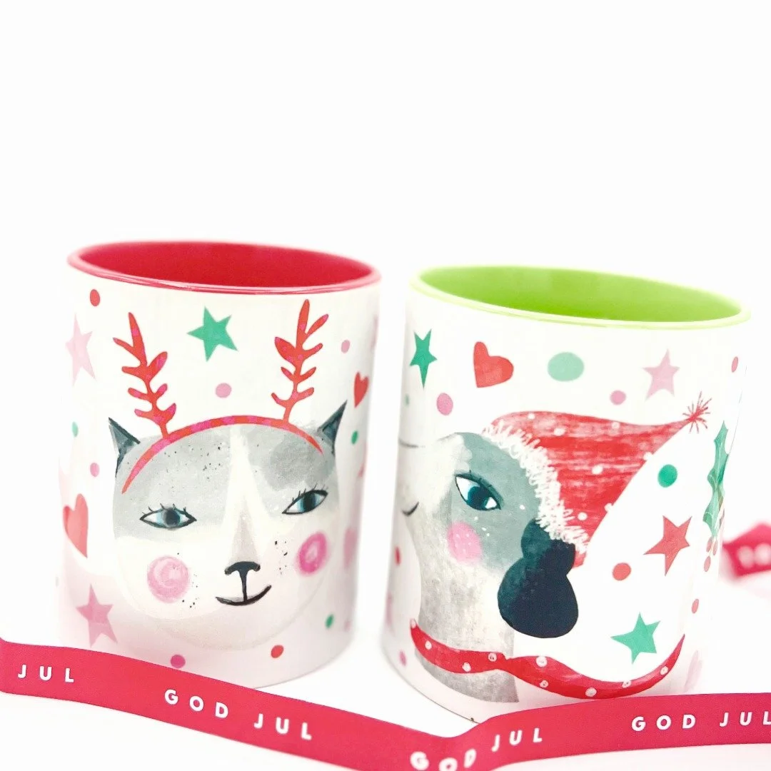 A photograph of Christmas Mugs with cat and dog by Susse Collection