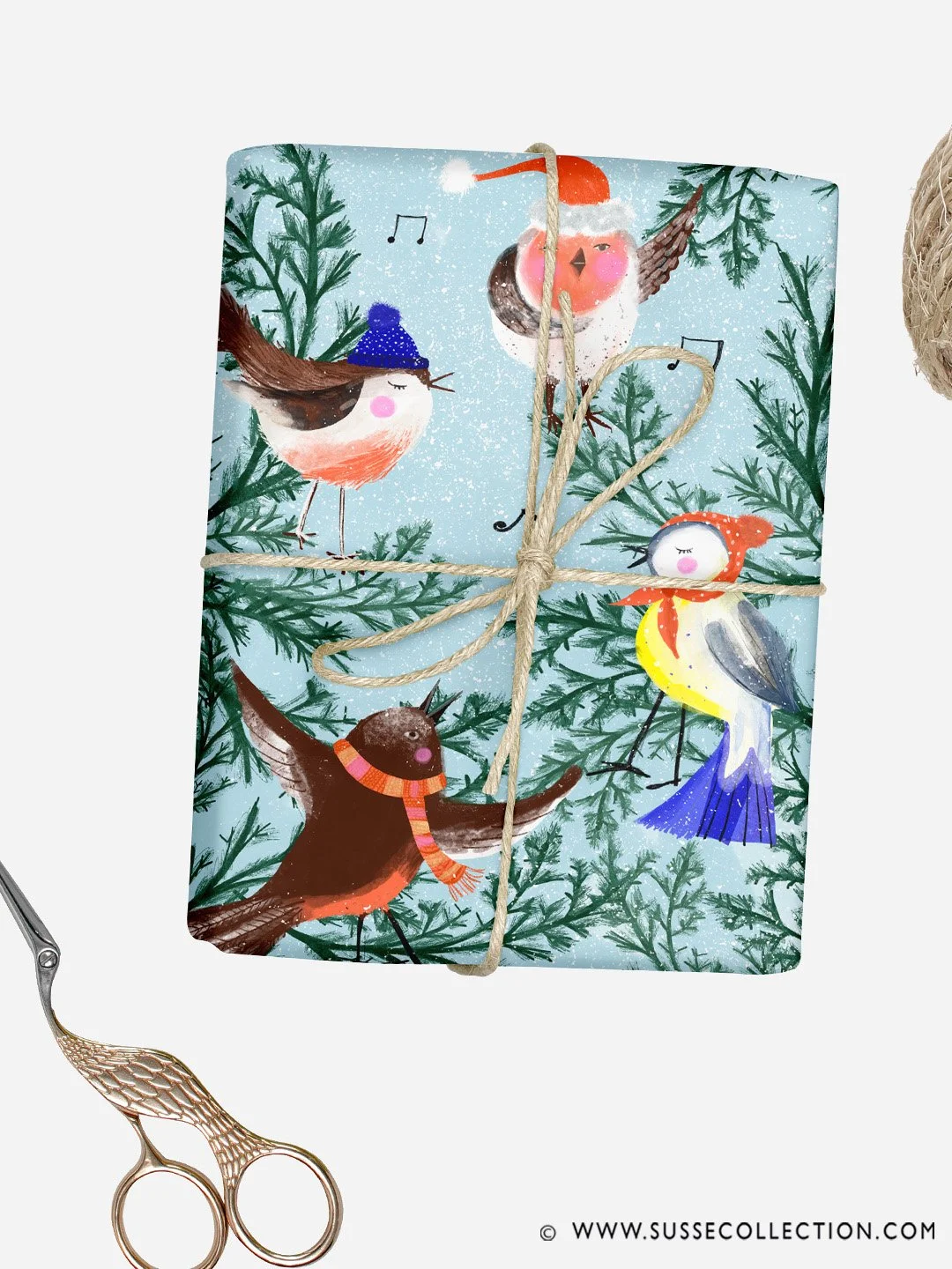 An illustration of Christmas Birds singing carols in a tree. on gift wrap