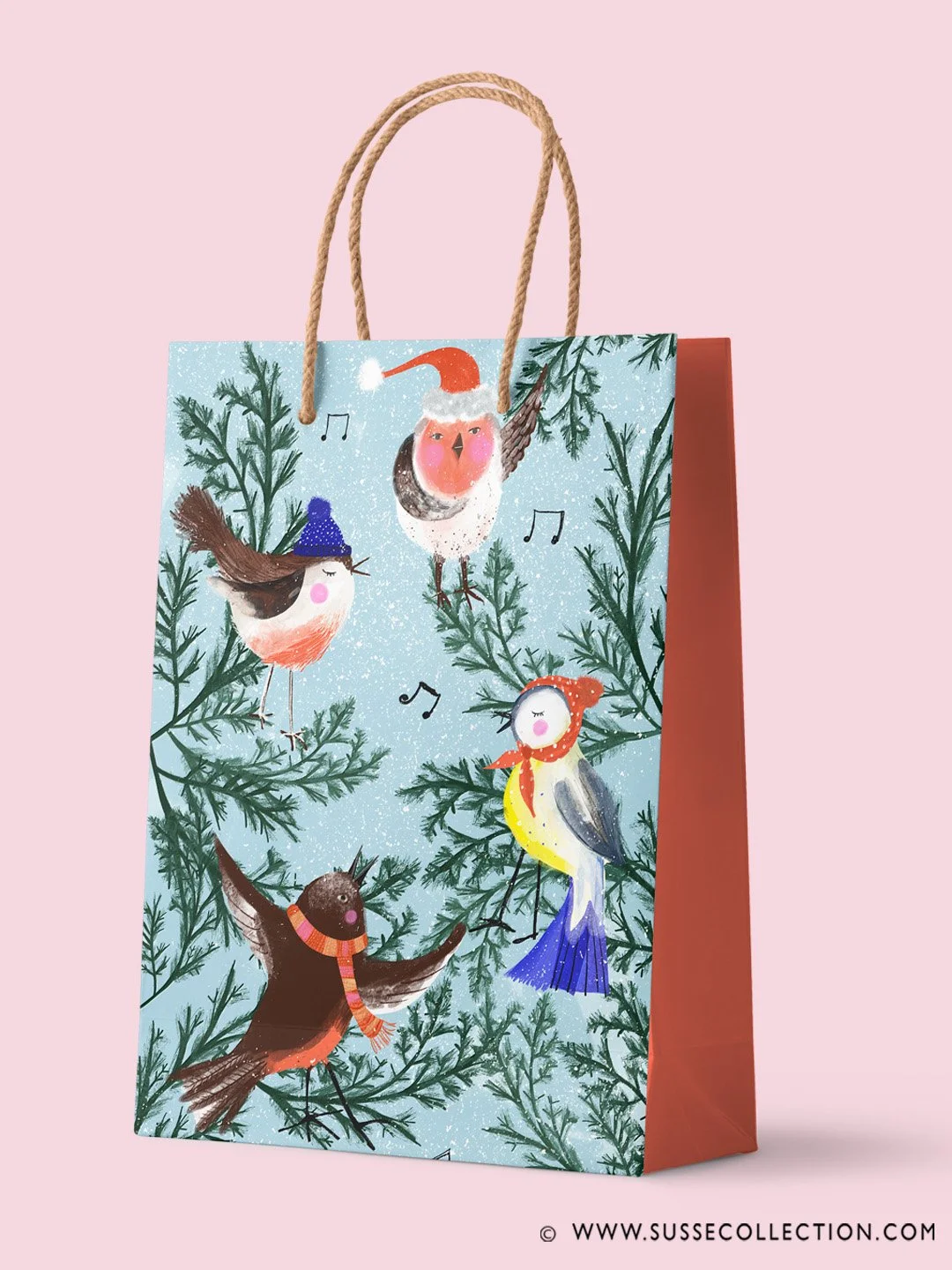 An illustration of Christmas Birds singing carols in a tree on a gift bag
