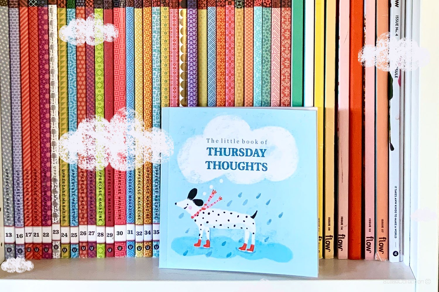 A photo of "the Little Book of Thursday Thoughts" on a book shelf .
