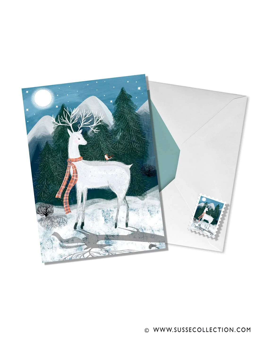A photograph of an illustration of winter scene of a Scottish white stag and Robbin  greeting card