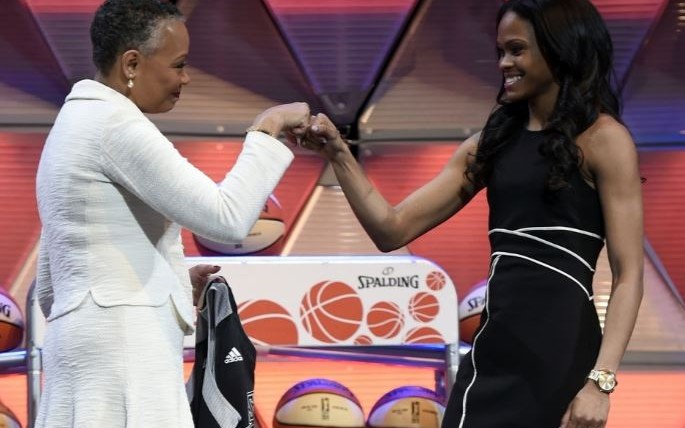 Lisa Borders fist-bumps second overall pick Moriah Jefferson during WNBA Draft. The Day/Sean D. Elliot