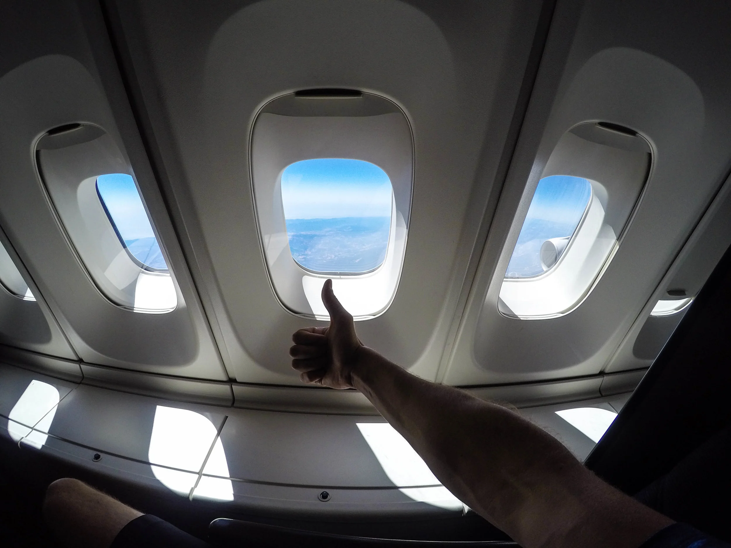 The best thing about being in the upper deck is having these huge storage bins next to your seat. You can fit your carry on inside of them so everything you need is right next to you.