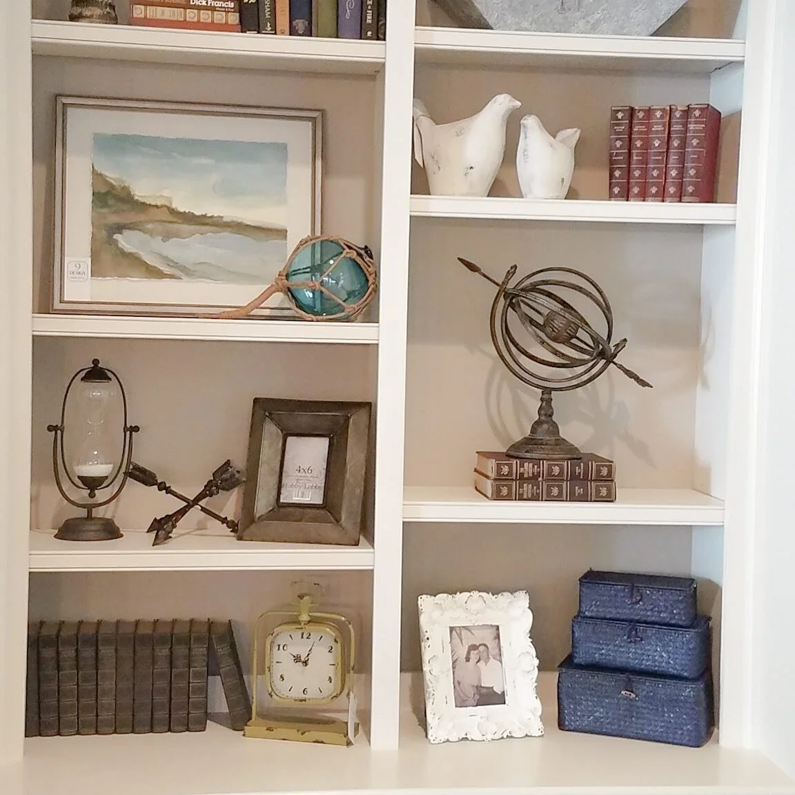 Do your bookshelves need some love?  Our design team can help. We bring our accessories into your home and blend them with your personal items to create a cohesive, balanced, and beautiful grouping. We make any changes you want, you keep what you lik