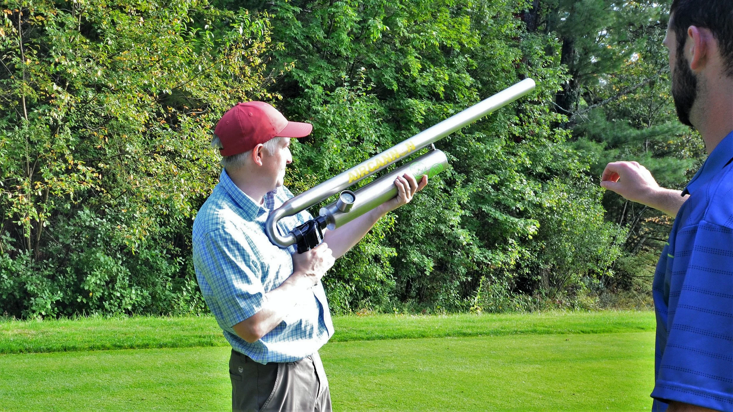 IT Director Elijah Lipson tries out the air cannon, a fun attraction featured at holes on both courses.