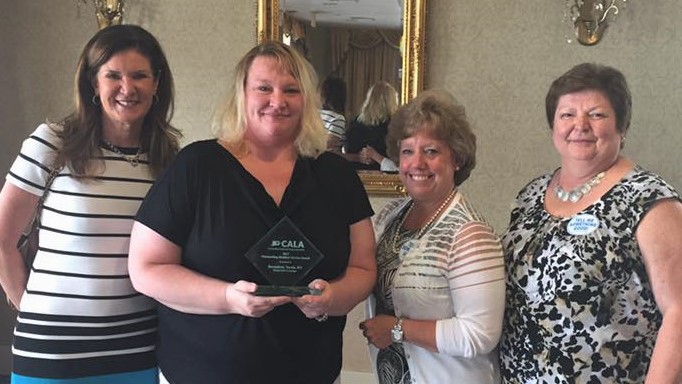 From left, Regional Director of Operations Kathy Hooker , CALA award winner Bernadette Tarzia , Regional Director of Resident Care Mary Lou Fahey and Regional Resident Care Specialist Joyce Farber .