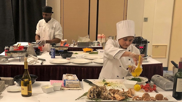 Chef Corina Rebello squeezes fresh lemon juice into gremolata, a classic garnish for osso buco.
