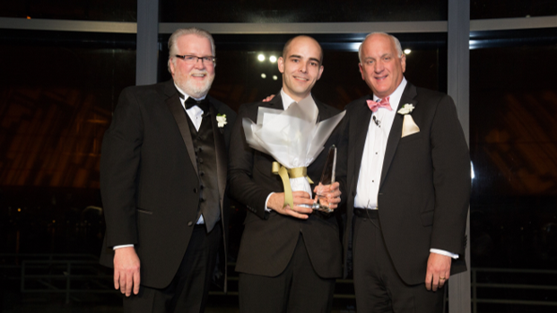 Shrewsbury Crossings Plant Operations Director John Sullivan , middle, accepts the Beacon Award from Senior Vice President of Operations Bob Moran , left , and Tom.