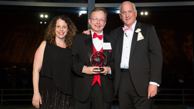 The Birches at Concord Executive Director Chuck Crush , center, accepts the Circle Award from Allison Melahouris and Tom.