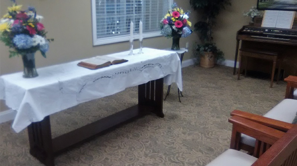 A member of the resident council advises the community on decorating the Spiritual Center for religious holidays.
