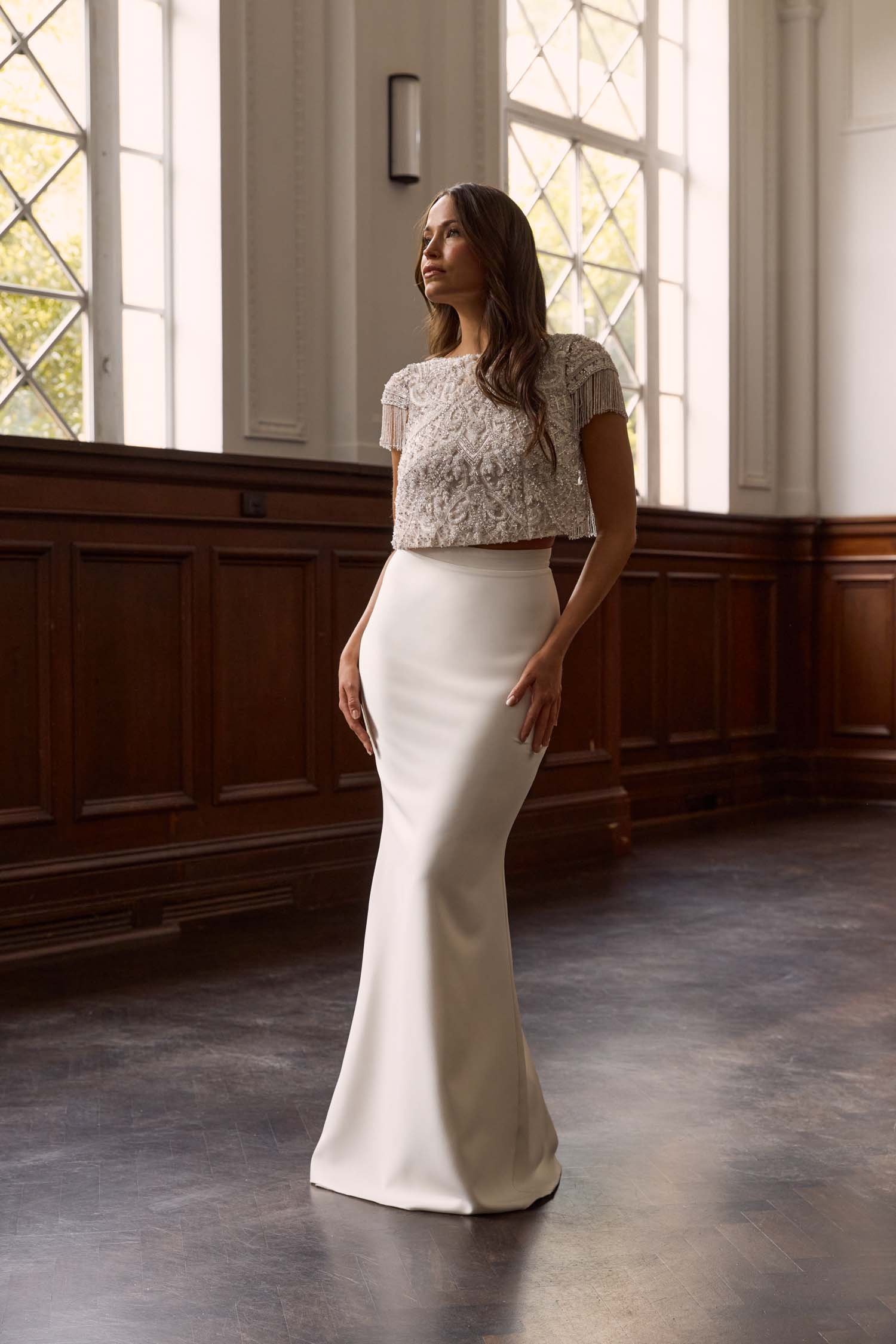Elevate your bridal look with the Dominic Skirt, crafted from luxurious ivory crepe for a sleek, minimalist silhouette. Perfect for pairing with any bridal toppers to create your unique style.
